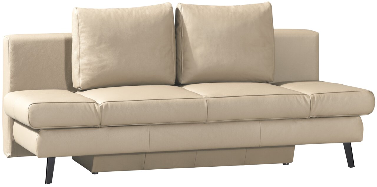 Beige hoekbank met twee grote rugkussens, zijaanzicht