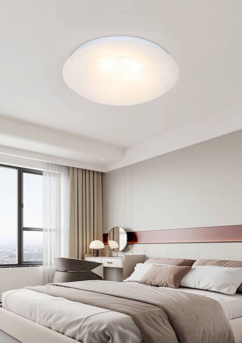 Moderne led-plafondlamp in een stijlvolle slaapkamer, van onderaf gezien.