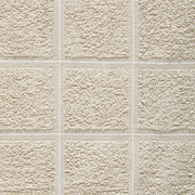 Nahaufnahme eines beigen Frottierhandtuchs mit quadratischem Muster