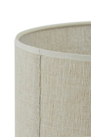Close-up van een beige lampenkap van geweven stof, gezien vanaf de zijkant