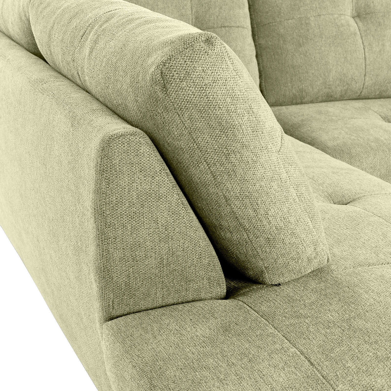 Nahaufnahme einer grünen Sofaecke mit gepolsterten Armlehnen und strukturiertem Stoffbezug, Perspektive von oben.