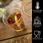 Ein hitzebeständiges Borosilikatglas mit Tee und Zitronenscheibe, von oben fotografiert. Spülmaschinengeeignet und lebensmittelecht.