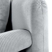 Close-up van een grijze functionele bank met geribbelde stoffen bekleding, gezien vanaf de zijkant