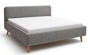 Graues Polsterbett mit Holzfüßen, seitliche Perspektive