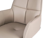 Nahaufnahme eines beigen Armlehnstuhls Novel MIAMI mit weicher Polsterung und eleganten Nähten, seitliche Perspektive.