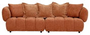 Großes, gemütliches Big-Sofa in braunem Stoff mit mehreren Kissen, Frontalansicht.