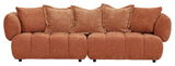 Großes, gemütliches Big-Sofa in braunem Stoff mit mehreren Kissen, Frontalansicht.