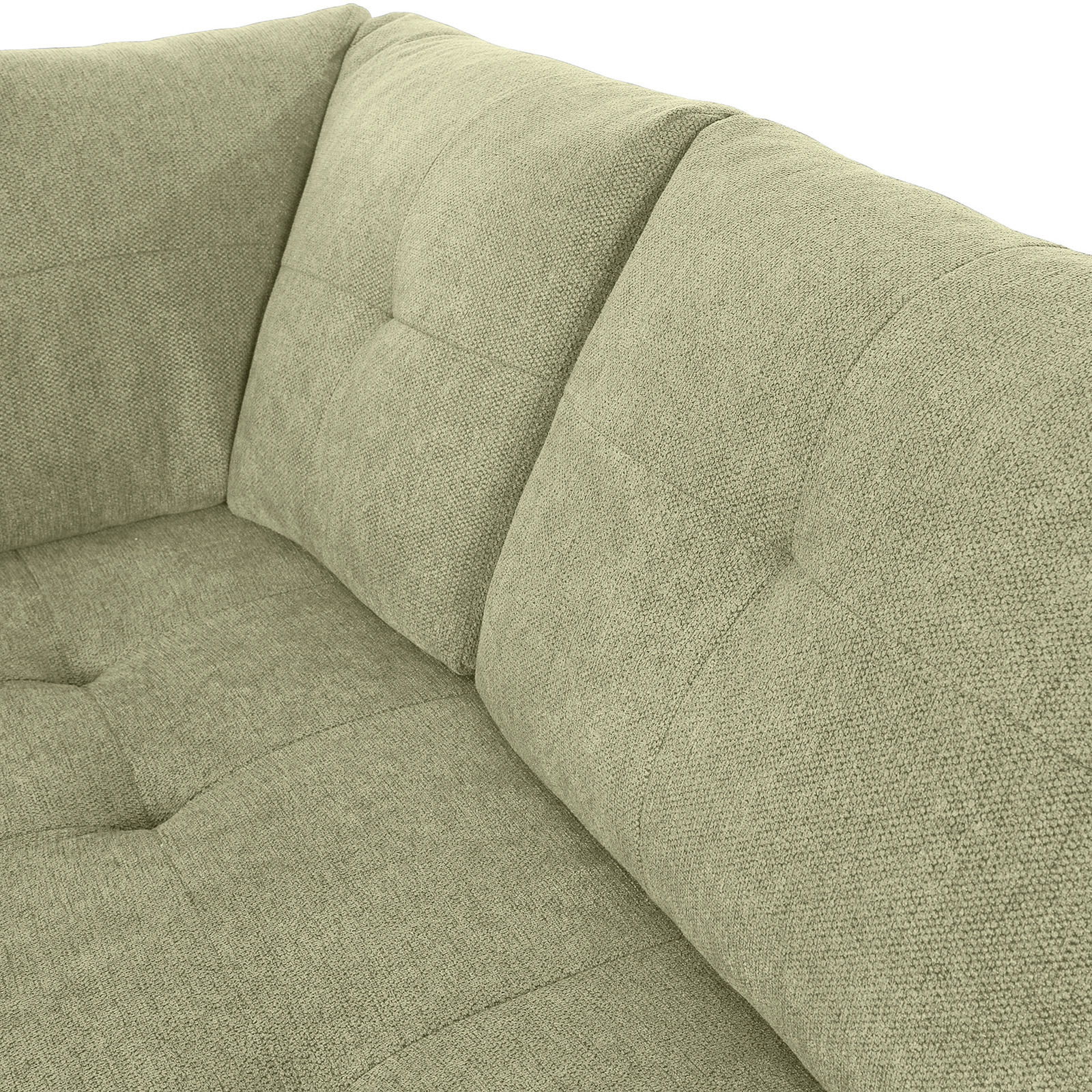 Nahaufnahme einer grünen Sofaecke mit gepolsterten Kissen und texturierter Oberfläche, Perspektive von oben.