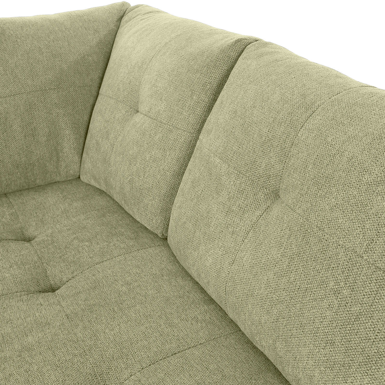 Nahaufnahme einer grünen Sofaecke mit gepolsterten Kissen und texturierter Oberfläche, Perspektive von oben.