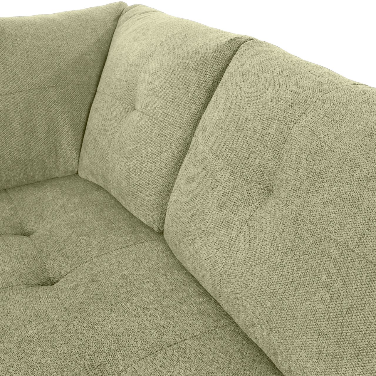 Nahaufnahme einer grünen Sofaecke mit gepolsterten Kissen und texturierter Oberfläche, Perspektive von oben.