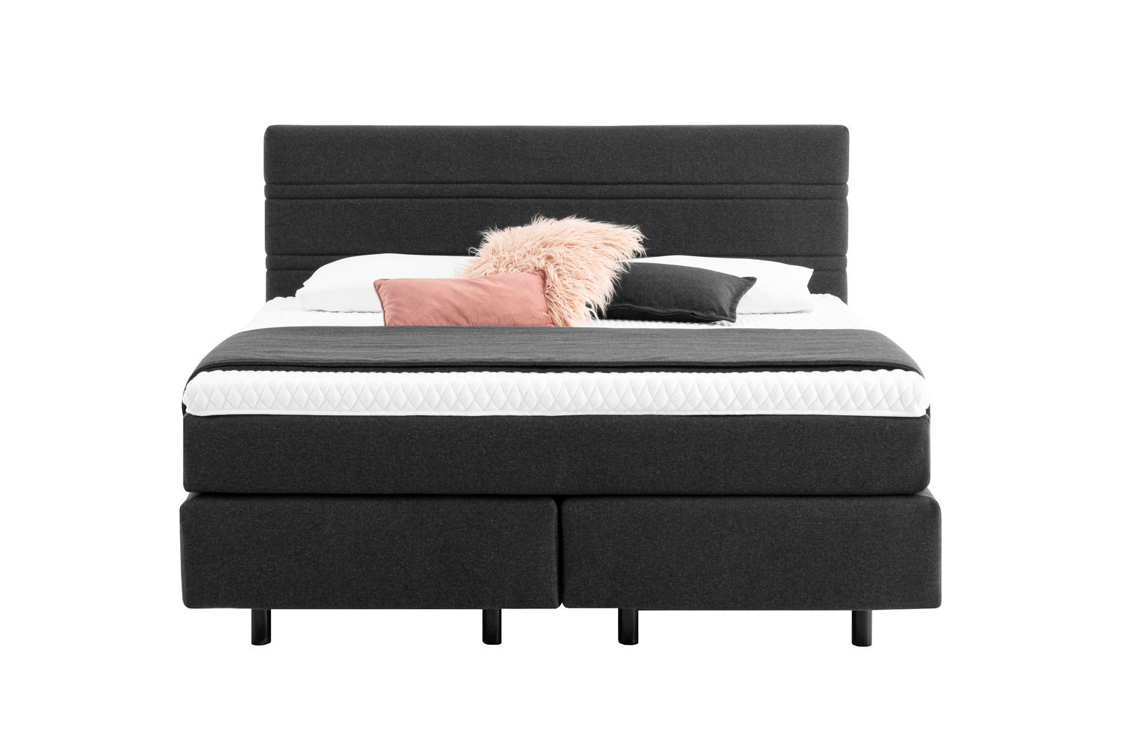 Boxspringbett in dunklem Stoffbezug mit Kopfteil, dekoriert mit Kissen, Frontalansicht