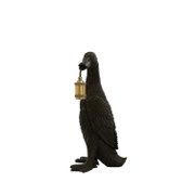 Schwarze Entenfigur als Deko-Lampe mit goldfarbener Laterne am Schnabel, freigestellt auf weißem Hintergrund, Ansicht von vorne leicht seitlich
