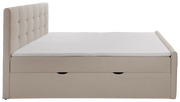 Seitenansicht eines beige Boxbetts mit gepolstertem Kopfteil und Stauraum.