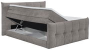 Boxspringbett in grauem Stoff mit geöffneter Bettkastenfunktion, seitliche Perspektive
