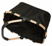 Schwarzer Einkaufskorb mit goldfarbenem Rahmen, von oben betrachtet.