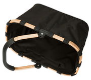 Schwarzer Einkaufskorb mit goldfarbenem Rahmen, von oben betrachtet.