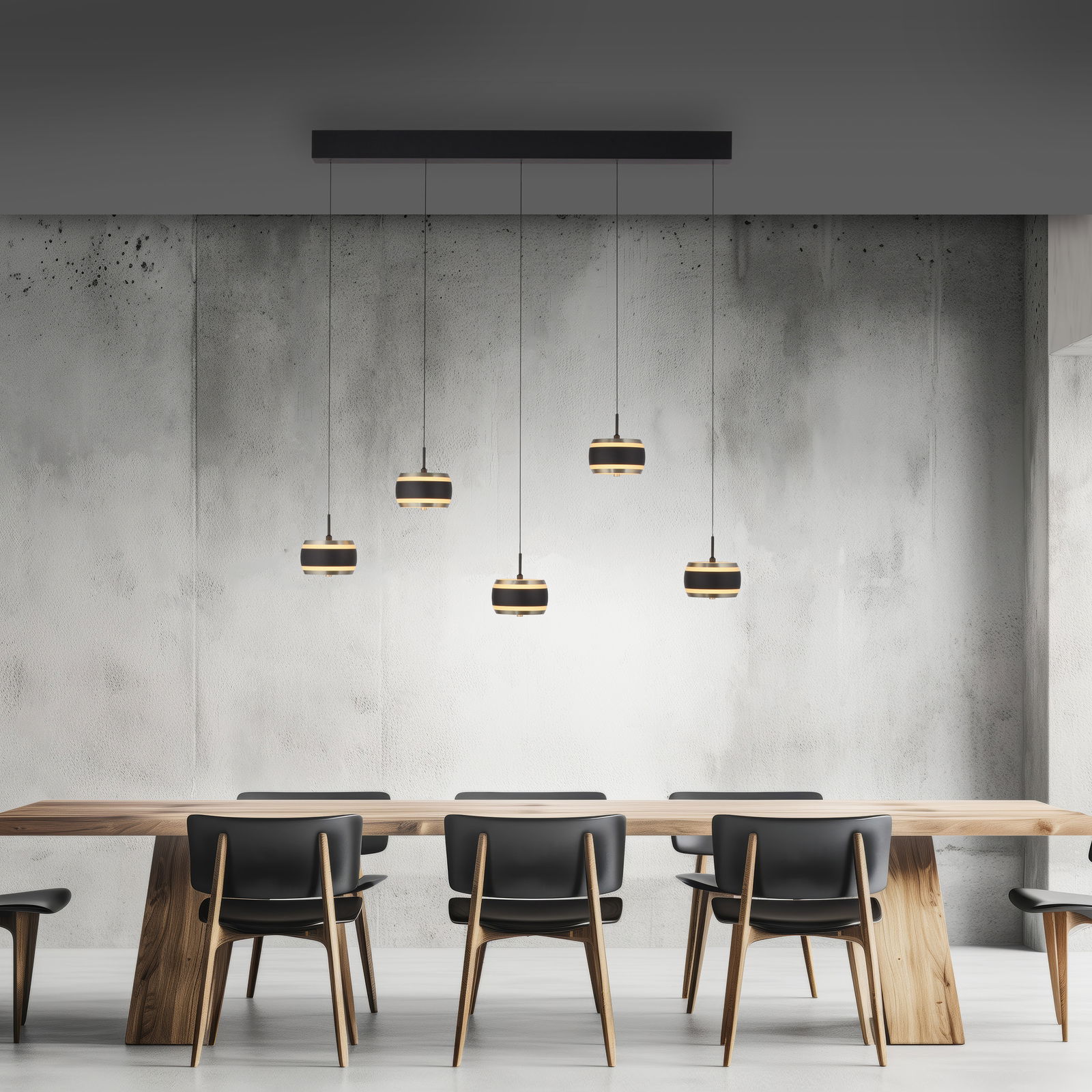 Neuhaus Pure LED-hanglamp PURE FALLING RINGS Moderne LED-Pendelleuchte mit fünf hängenden Lampen über einem Esstisch, seitliche Perspektive.