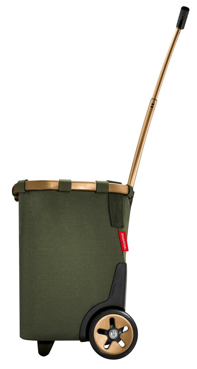 Seitenansicht eines grünen carrycruisers mit goldfarbenem Griff und Rädern.