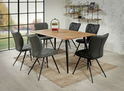 Moderner Esstisch mit Holzplatte und schwarzen Metallbeinen, umgeben von sechs gepolsterten Stühlen in einem Esszimmer mit großen Fenstern, seitliche Perspektive.