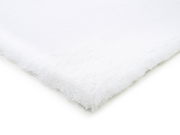 Nahaufnahme eines weißen Fellteppichs aus der Vogelperspektive