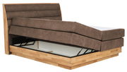 Boxspringbett mit hochgeklappter Matratze und Stauraum, seitliche Perspektive