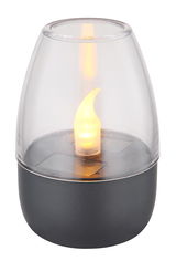 Nahaufnahme einer Solarleuchte mit flammenförmigem LED-Licht in einem transparenten Gehäuse auf einem dunklen Sockel.