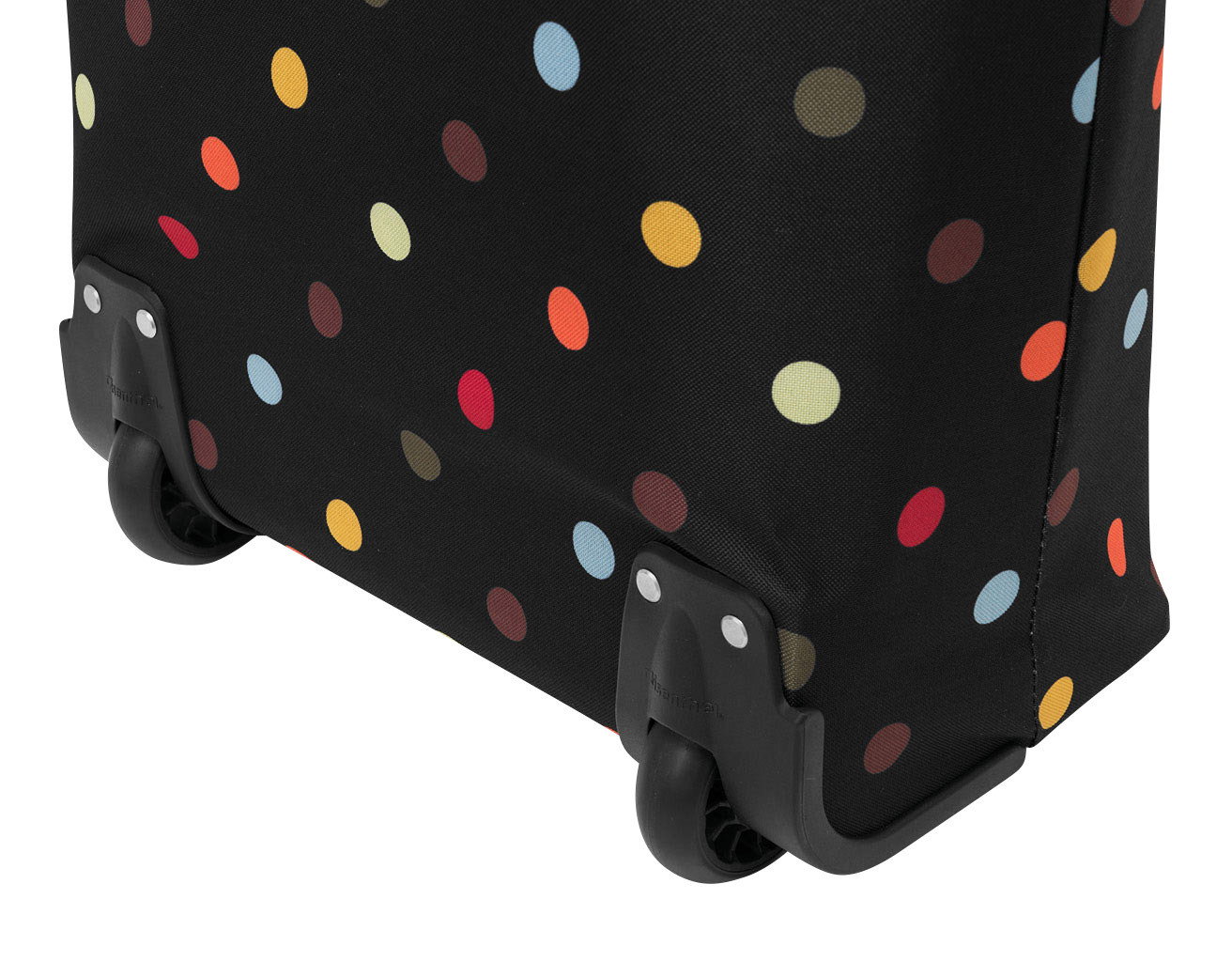 Nahaufnahme eines schwarzen Trolleys mit bunten Punkten und zwei Rollen, seitliche Perspektive.