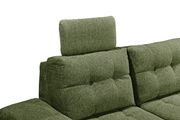 Grünes Sofa mit verstellbarer Kopfstütze, seitliche Perspektive