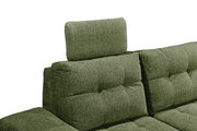 Grünes Sofa mit verstellbarer Kopfstütze, seitliche Perspektive