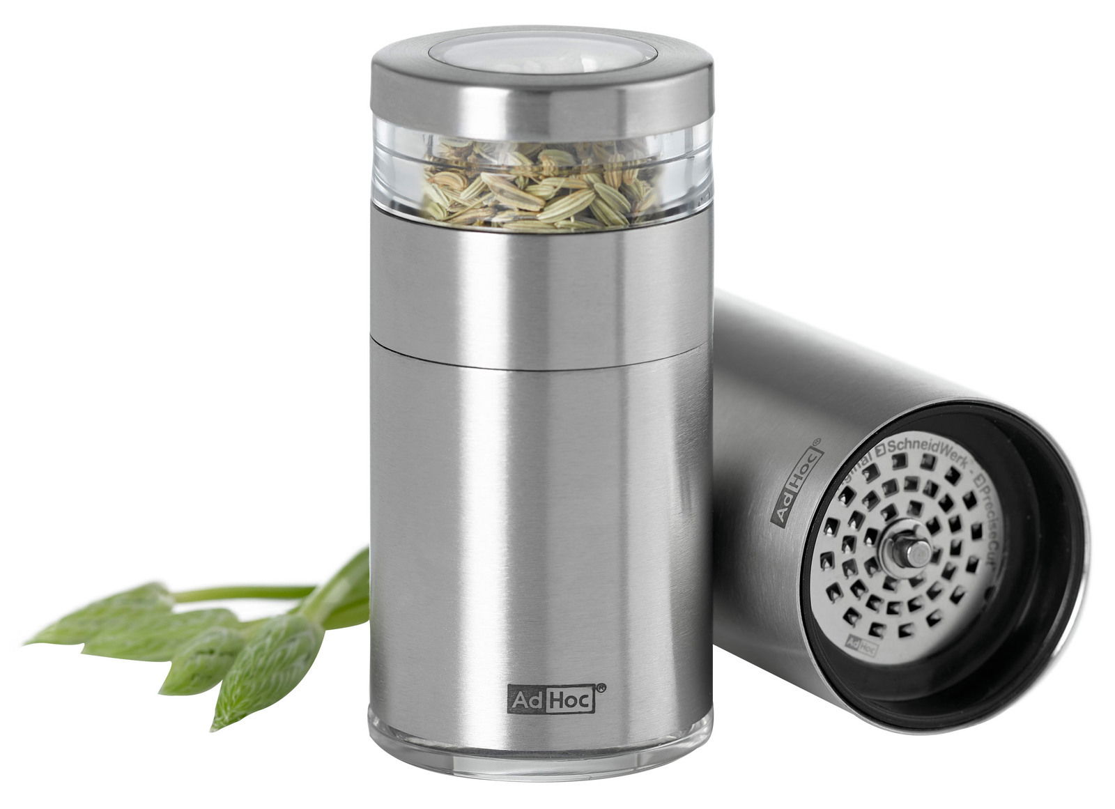 Moderner Kräuter- und Gewürzschneider aus Edelstahl mit transparentem Behälter, gefüllt mit Gewürzen, und einem abnehmbaren Deckel. Perspektive zeigt das Produkt von vorne und die Unterseite.
