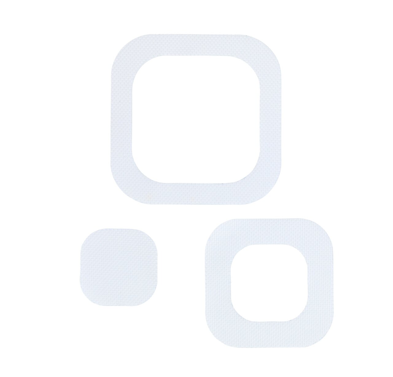 Drei weiße, eckige Anti-Rutschsticker in verschiedenen Größen, von oben betrachtet.