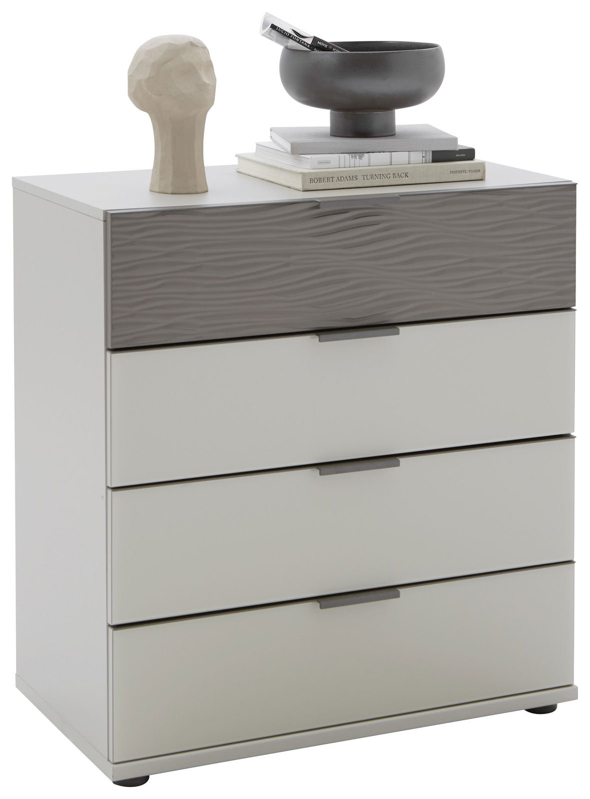 Schubkastenkommode mit vier Schubladen, obere Schublade mit wellenförmiger Struktur, dekoriert mit einer Skulptur und einer Schale, Perspektive von vorne.