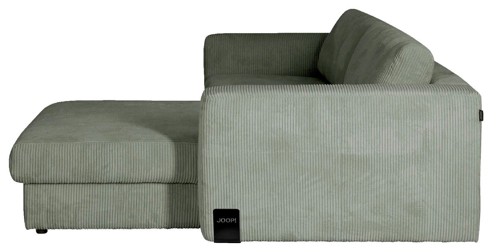 Zijaanzicht van een moderne lichtgroene corduroy hoekbank met brede chaise longue, zachte rugkussens en afgeronde vormen