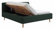 Polsterbett in dunklem Grün mit hochgeklappter Matratze, seitliche Perspektive