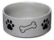 Grauer Hundenapf mit schwarzen Pfotenabdrücken und Knochenmotiven, seitliche Perspektive