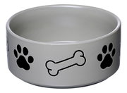 Grauer Hundenapf mit schwarzen Pfotenabdrücken und Knochenmotiven, seitliche Perspektive