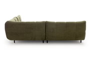 Achterkant van een groene hoekbank met geribbelde stoffen bekleding en zwarte poten.