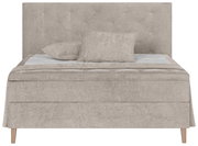 Frontale Ansicht eines beigen Boxspringbetts mit Kopfteil und zwei Kissen.
