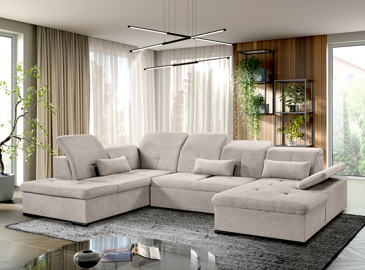 Moderne, graue Rundecke mit verstellbaren Kopfstützen und Kissen, in einem stilvoll eingerichteten Wohnzimmer mit Blick auf die Fensterfront.