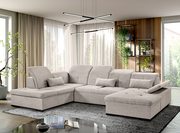 Moderne, graue Rundecke mit verstellbaren Kopfstützen und Kissen, in einem stilvoll eingerichteten Wohnzimmer mit Blick auf die Fensterfront.