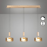 Moderne 3-flammige Pendelleuchte mit drei zylindrischen, amberfarbenen Glasschirmen und beigem Baldachin, frontal von unten an der Decke hängend