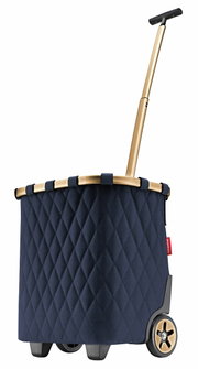 Seitenansicht eines blauen Carrycruisers mit rhombenförmigem Muster und goldfarbenem Griff.
