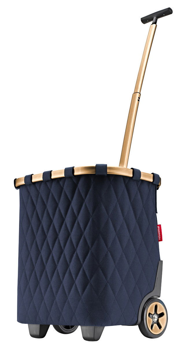 Seitenansicht eines blauen Carrycruisers mit rhombenförmigem Muster und goldfarbenem Griff.