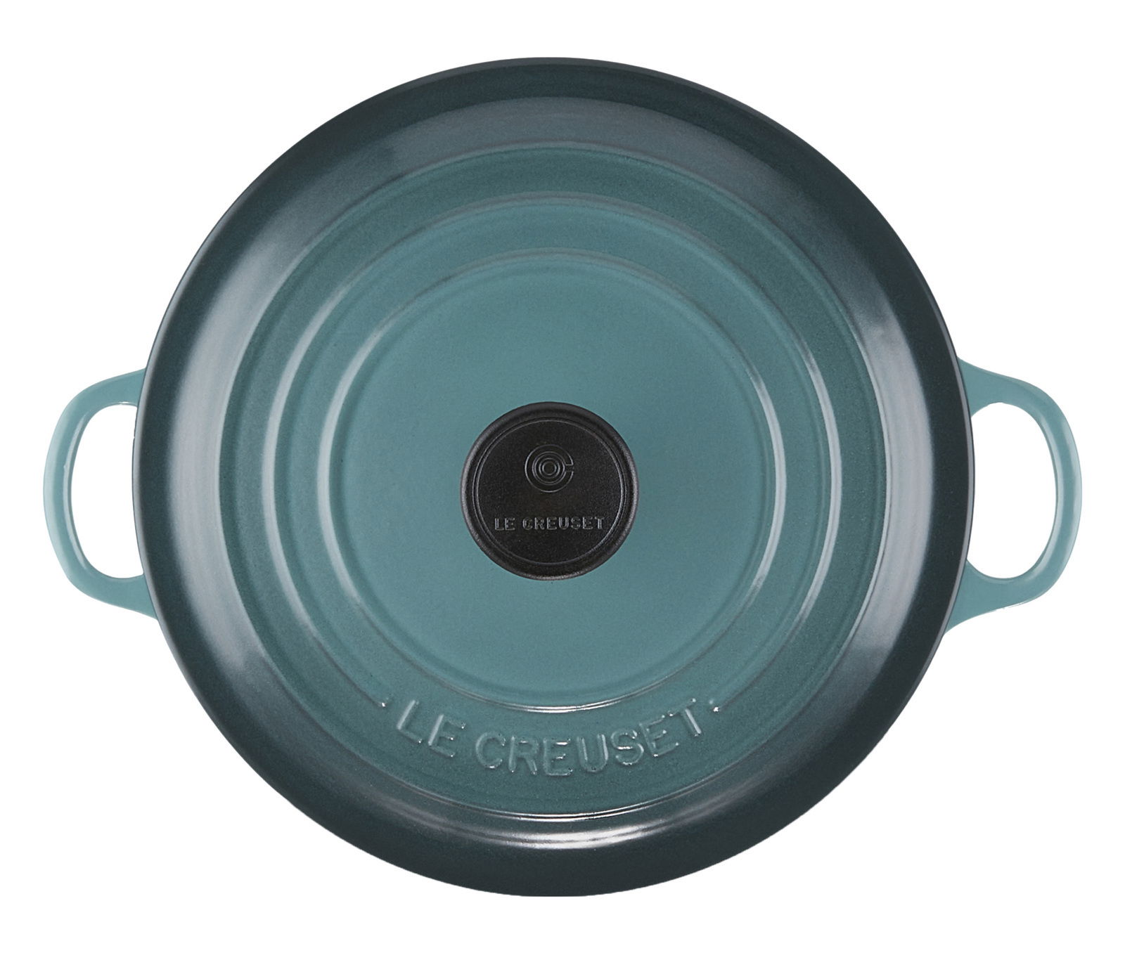 Vogelperspektive auf einen runden, blauen Bräter mit zwei Griffen und einem schwarzen Knauf, Marke Le Creuset.