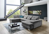 Graue Polsterrundecke Beldomo Style BOCHUM in einem modernen Wohnzimmer mit großen Fenstern und Treppe, seitliche Perspektive.