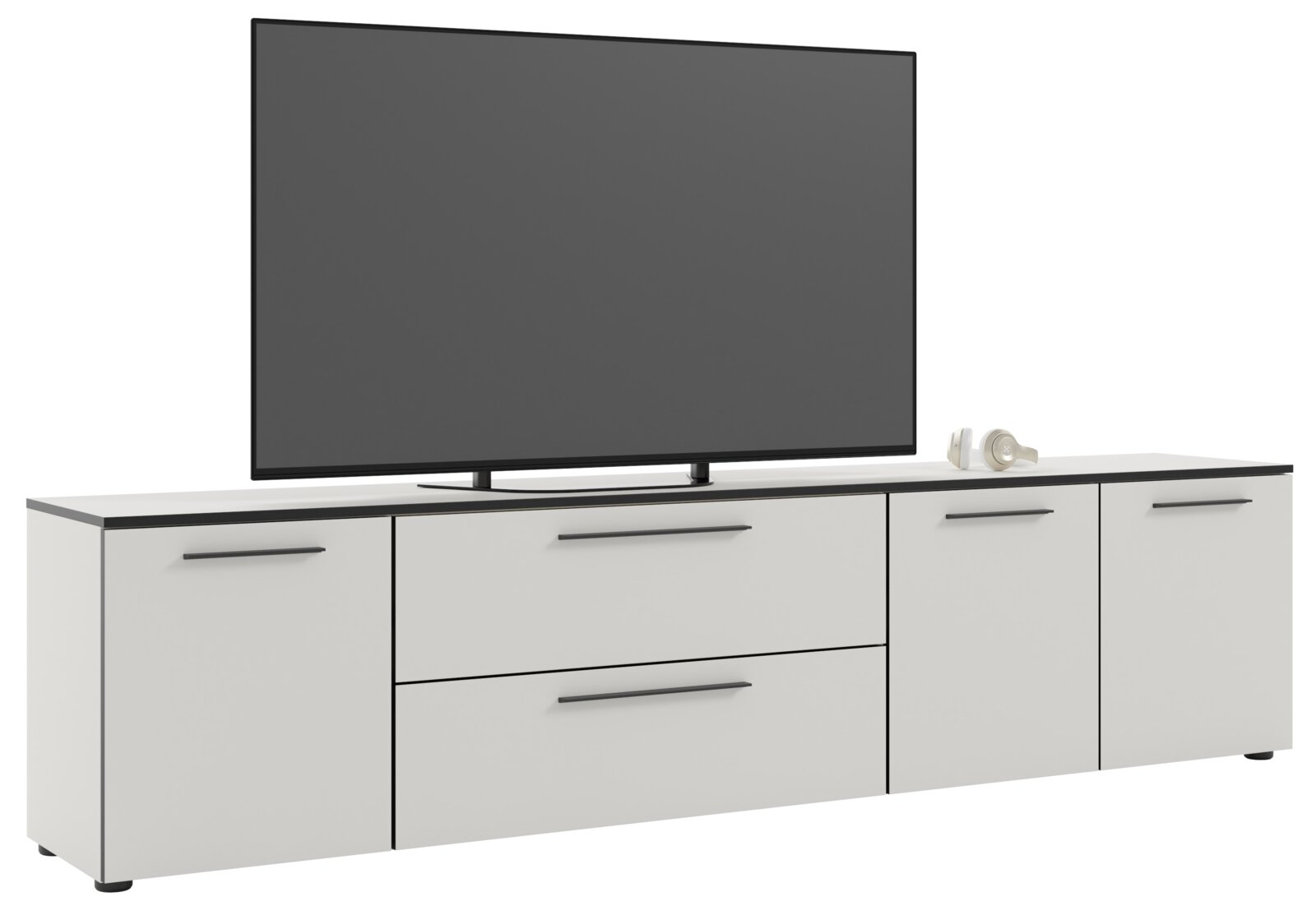 Frontansicht eines weißen XL-TV-Lowboards mit zwei Schubladen und vier Türen, darauf steht ein großer Flachbildfernseher.