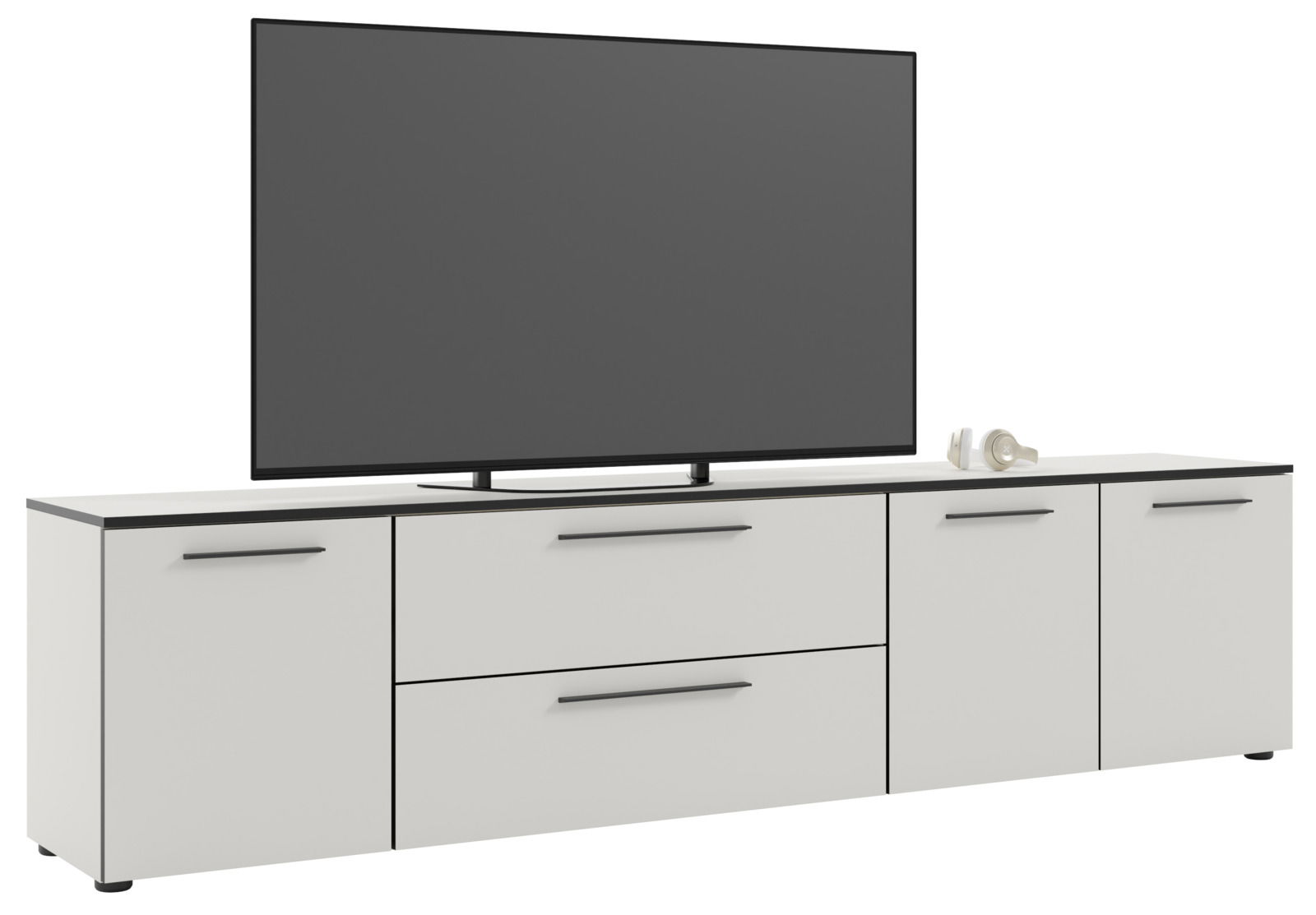 Frontansicht eines weißen XL-TV-Lowboards mit zwei Schubladen und vier Türen, darauf steht ein großer Flachbildfernseher.
