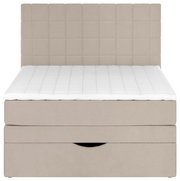 Beiges Boxspringbett mit gepolstertem, quadratisch abgestepptem Kopfteil und weißer, gesteppter Matratzenauflage, Frontansicht.