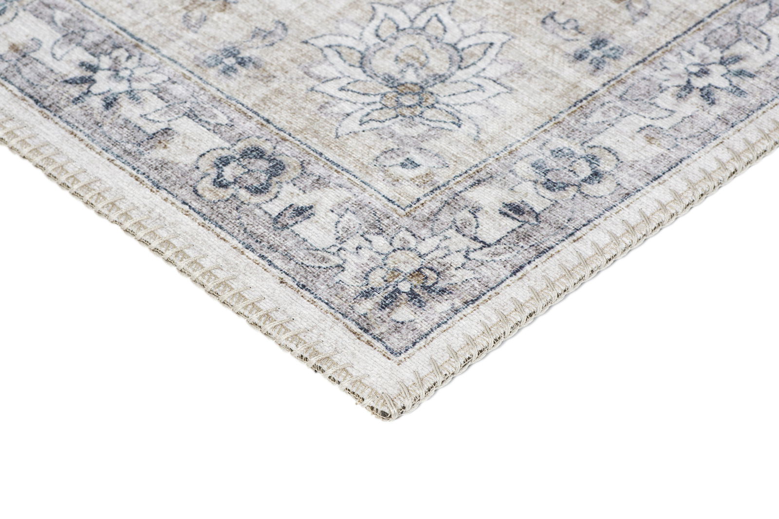 Ecke eines Teppichs mit floralen Mustern in sanften Beige- und Blautönen, von oben betrachtet.