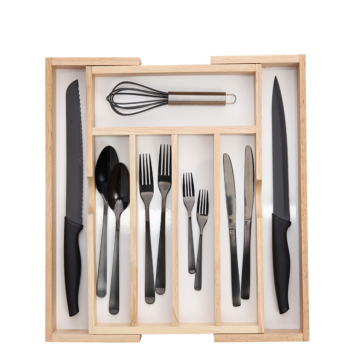 Vogelperspektive auf einen ausziehbaren Besteckkasten mit schwarzem Besteck und Küchenutensilien.